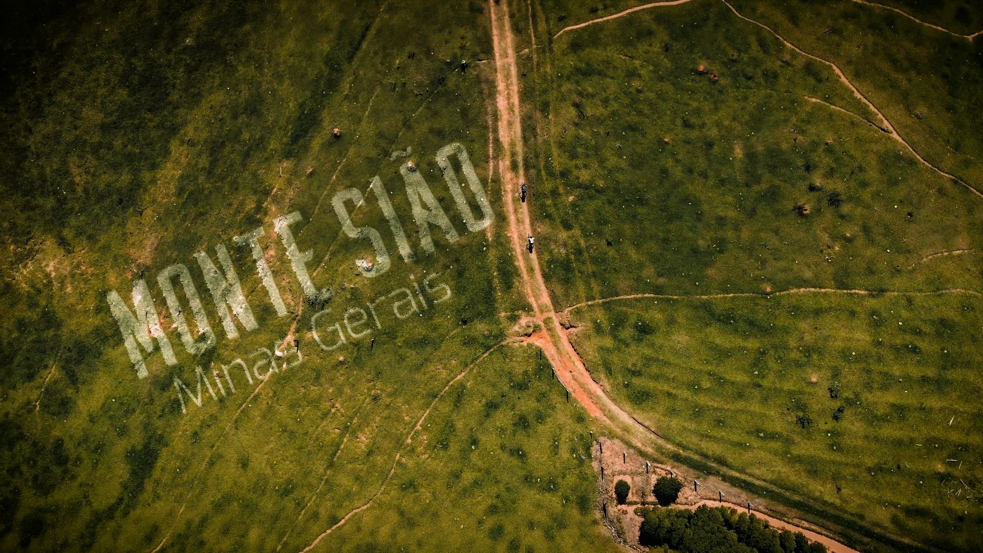 Aerial view of the course with Monte Sião lettering integrated into the landscape